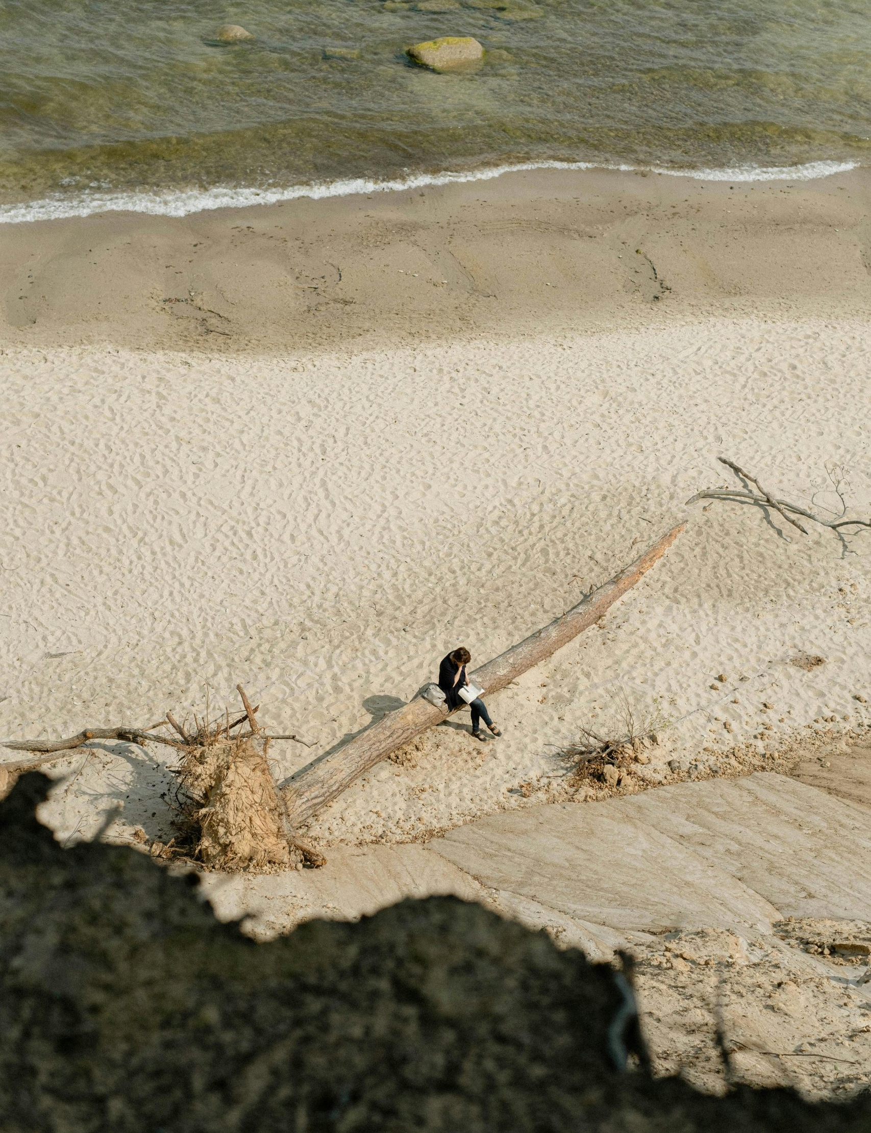 people-outdoors-beach person reading on the beach