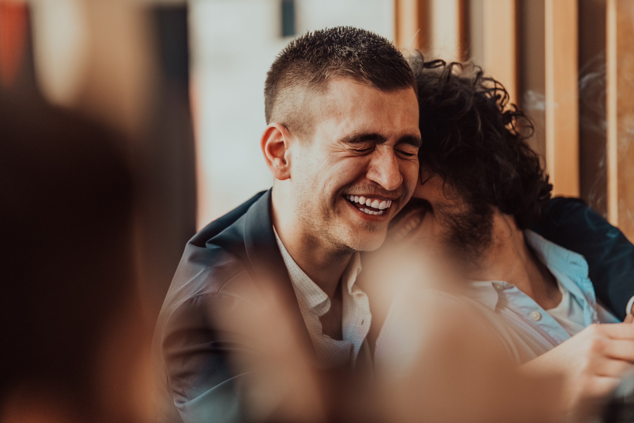 Couple laughing together Portrait of LGBTQ+ couple laughing together